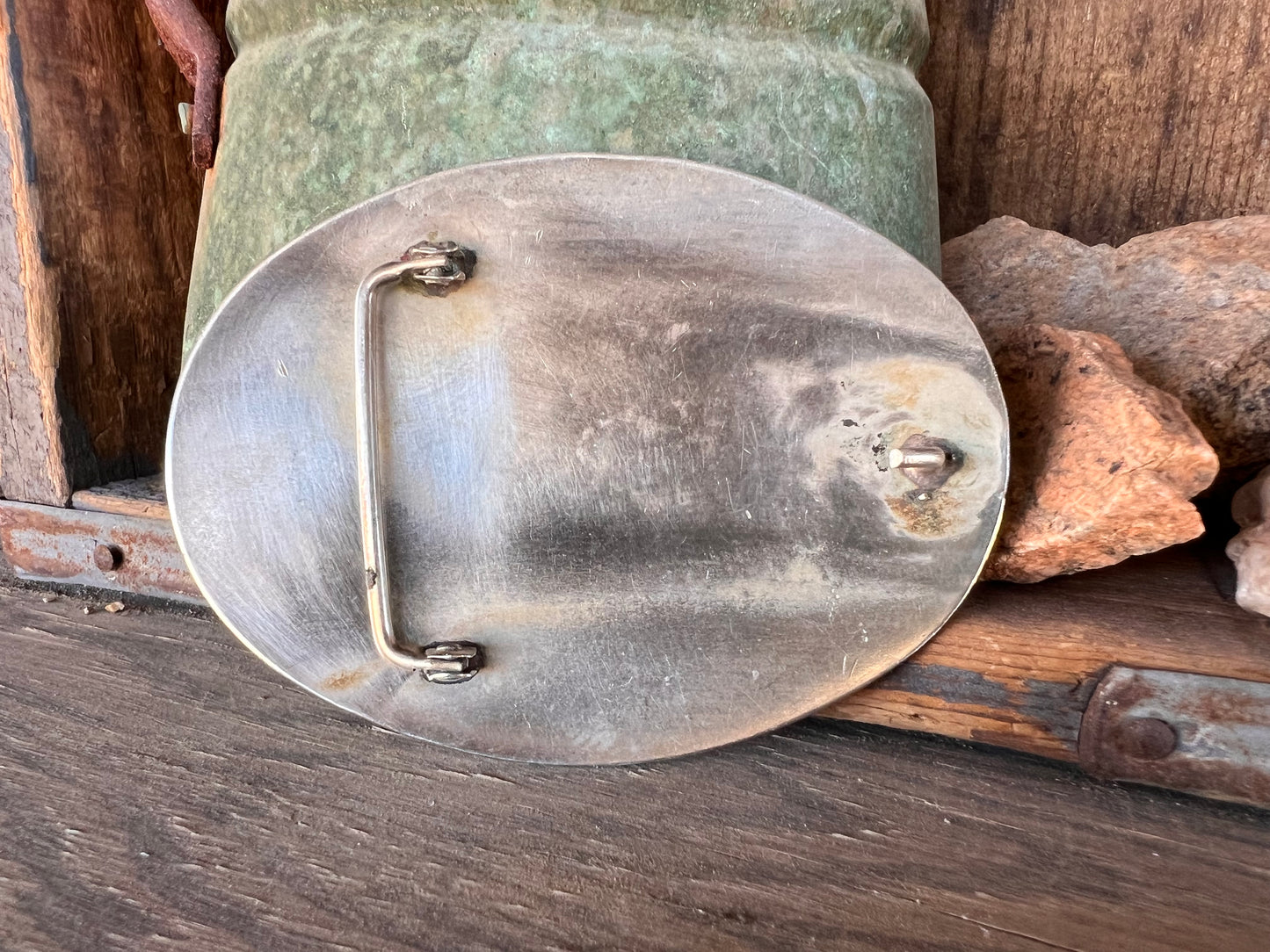 “Vintage Southwestern custom ranch buckle with turquoise inlay and outlaw pistol motif.”